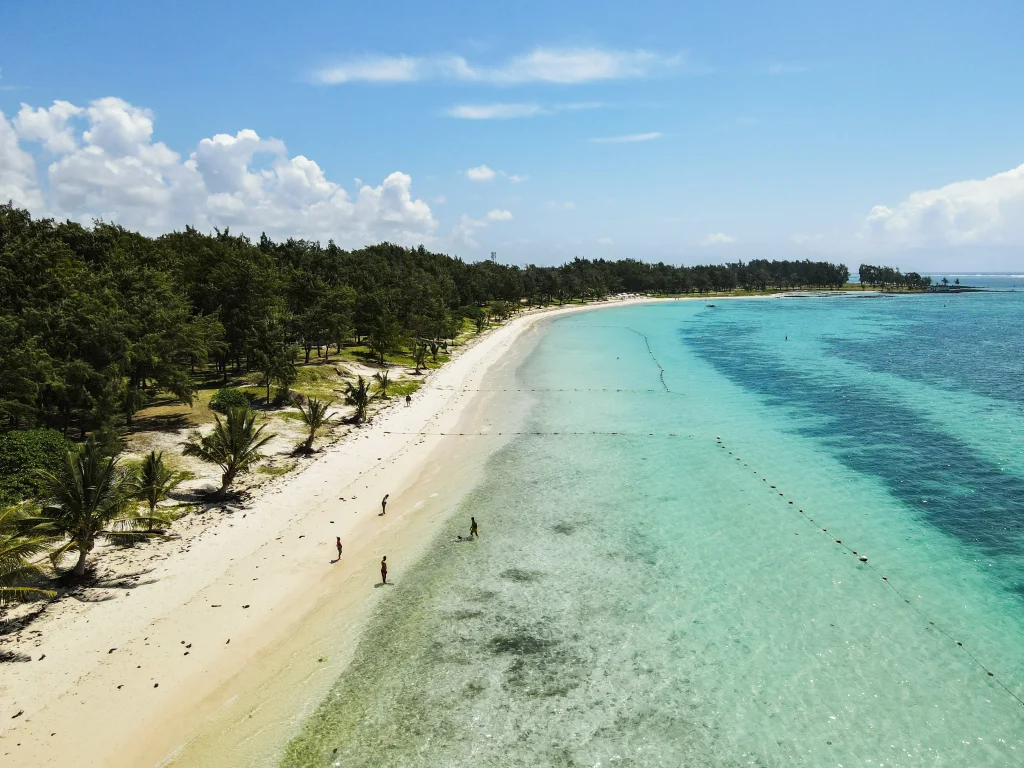 Mauritius beach with turquoise waters and clear skies, ideal for first-time visitors exploring the island's natural beauty.