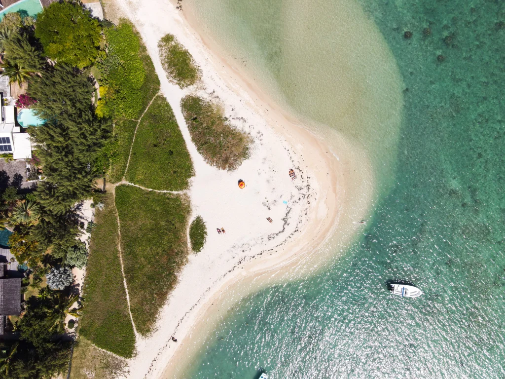 Top hidden gems and attractions in North Mauritius including Bain Boeuf Beach, Cap Malheureux, L’Aventure du Sucre, and scenic coastal viewpoints.